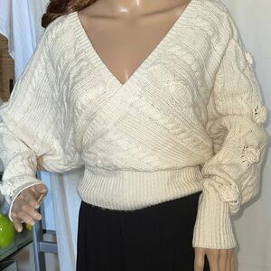Cream Colored Dolman Sleeve Sweater.
Rosettes, Slouchy.